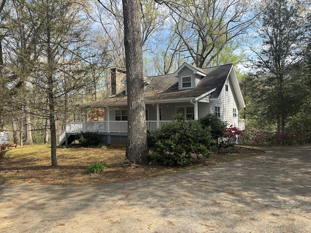 view of property exterior featuring covered porch