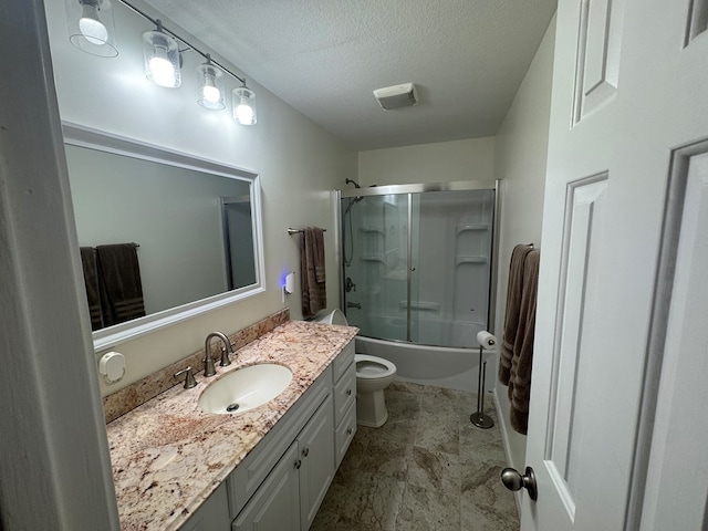bathroom with combined bath / shower with glass door, a textured ceiling, toilet, and vanity
