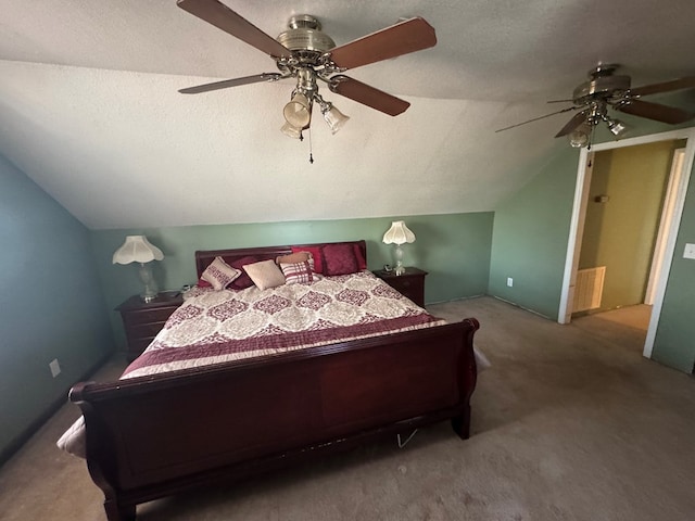 carpeted bedroom featuring lofted ceiling, a ceiling fan, and a textured ceiling