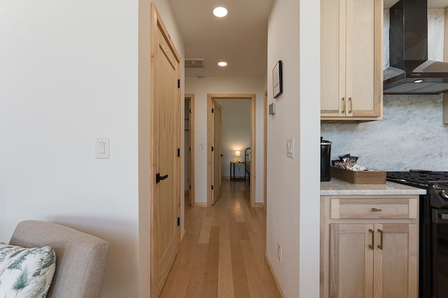 hall with light wood-type flooring