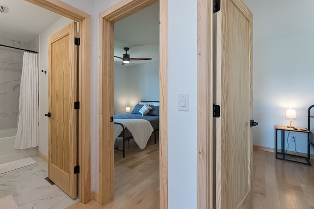 hallway with light wood-type flooring