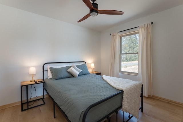 bedroom featuring ceiling fan and light wood-type flooring