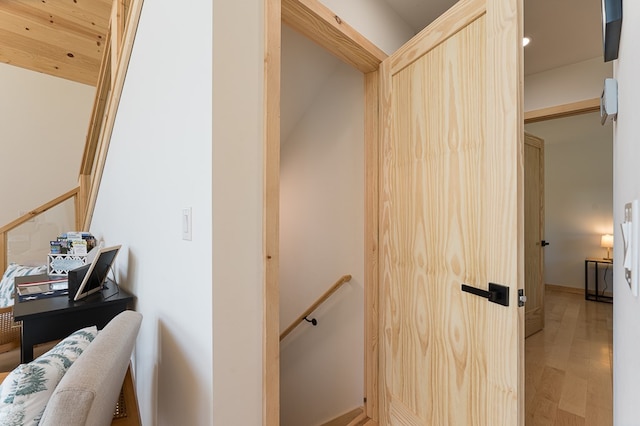 stairs with hardwood / wood-style floors