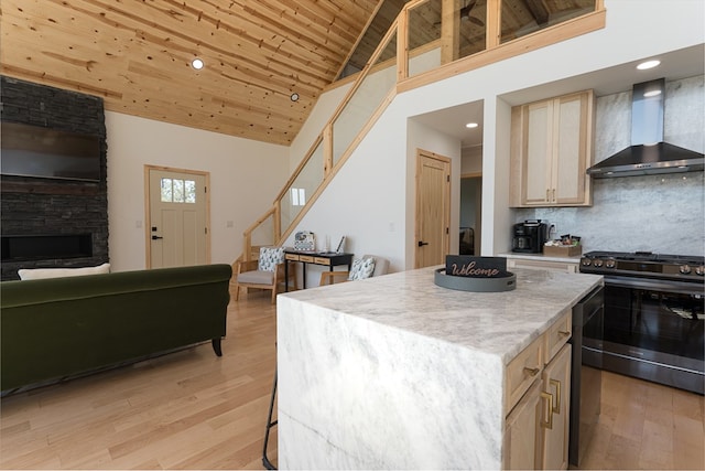 kitchen featuring stainless steel range, wall chimney exhaust hood, high vaulted ceiling, and wooden ceiling