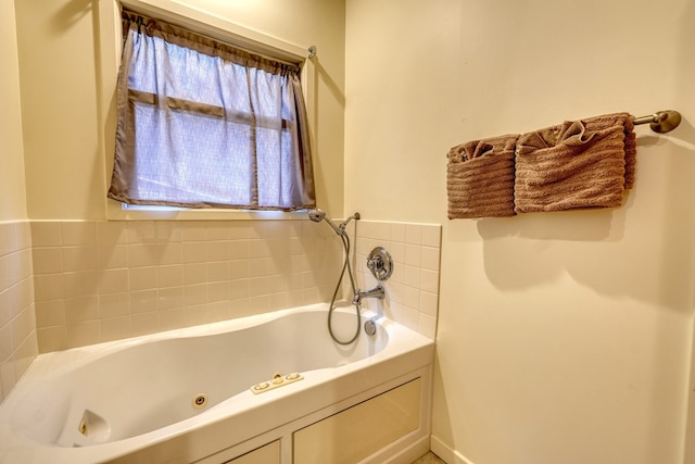 full bathroom with a whirlpool tub