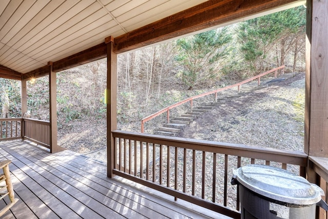 wooden terrace featuring stairs