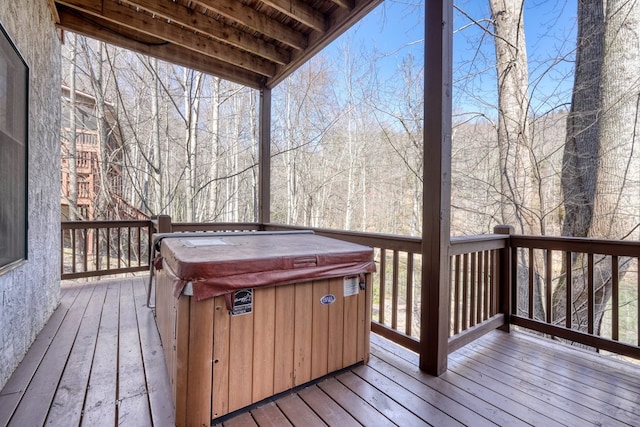 deck featuring a hot tub