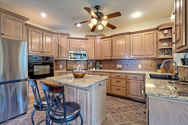 kitchen featuring a kitchen island, a breakfast bar area, black appliances, open shelves, and a sink