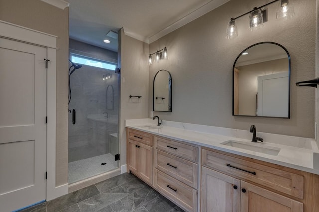 bathroom featuring a sink, crown molding, double vanity, and a shower stall