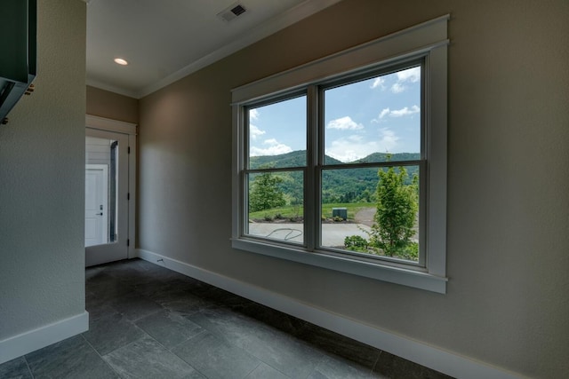 unfurnished dining area with a healthy amount of sunlight, visible vents, baseboards, and ornamental molding