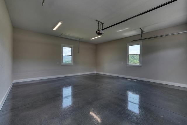 garage with baseboards and a garage door opener