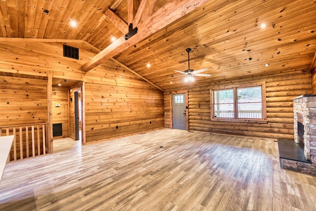 unfurnished living room with rustic walls, ceiling fan, beamed ceiling, light hardwood / wood-style floors, and wood ceiling