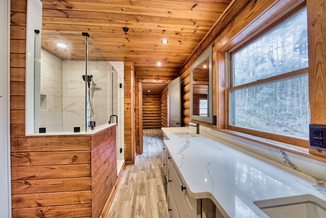 bathroom featuring hardwood / wood-style flooring, a wealth of natural light, wood ceiling, and log walls