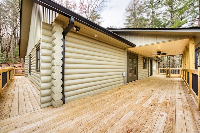 wooden terrace featuring ceiling fan