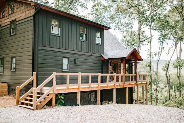 back of house with a wooden deck