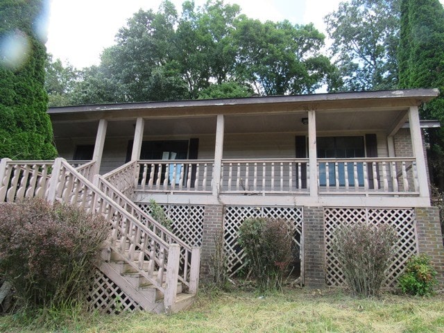 rear view of house with a porch