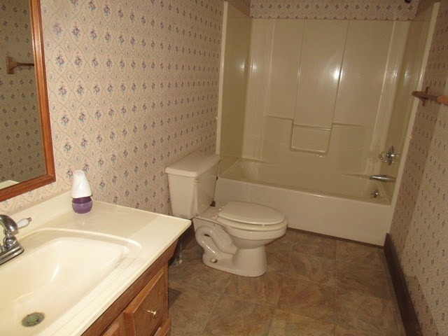 full bathroom with shower / bathing tub combination, vanity, toilet, and tile patterned floors