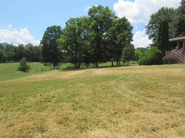 view of yard with a rural view