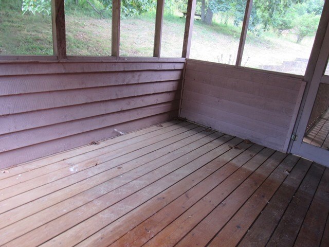 unfurnished sunroom featuring plenty of natural light