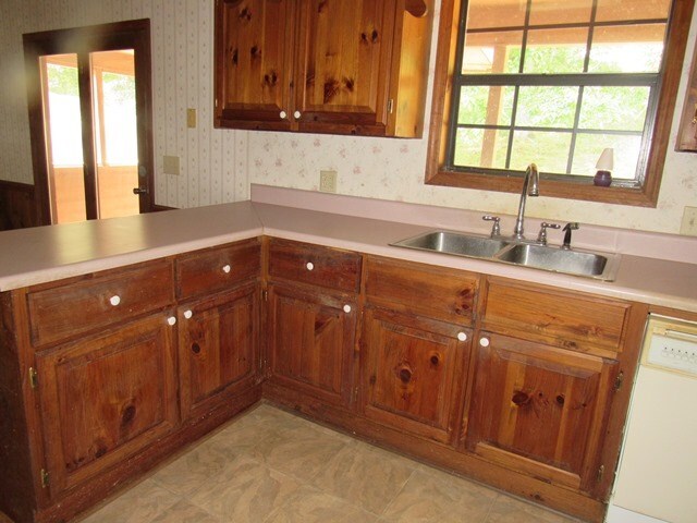 kitchen with white dishwasher and sink