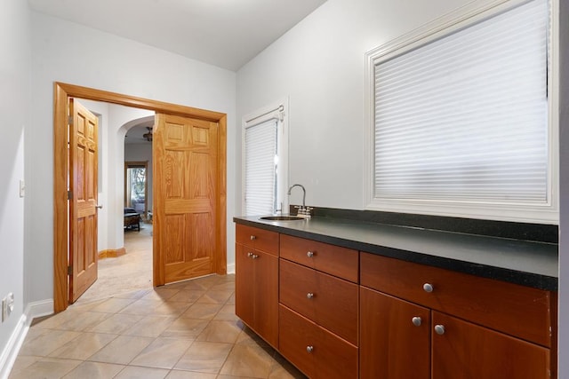 kitchen with sink and light tile patterned flooring