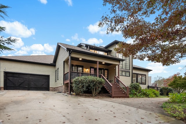 view of front of house featuring a garage and covered porch