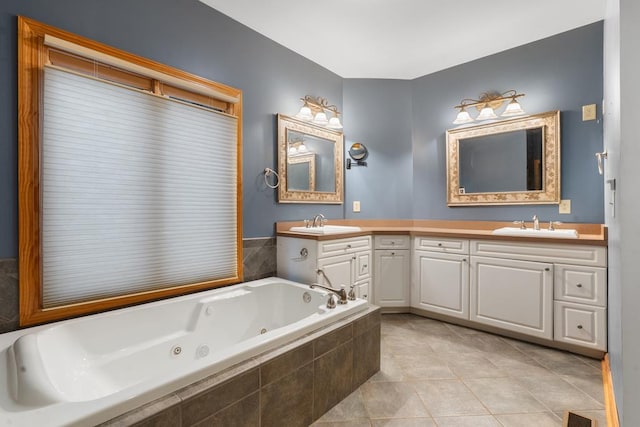 bathroom featuring vanity, tile patterned floors, and a relaxing tiled tub