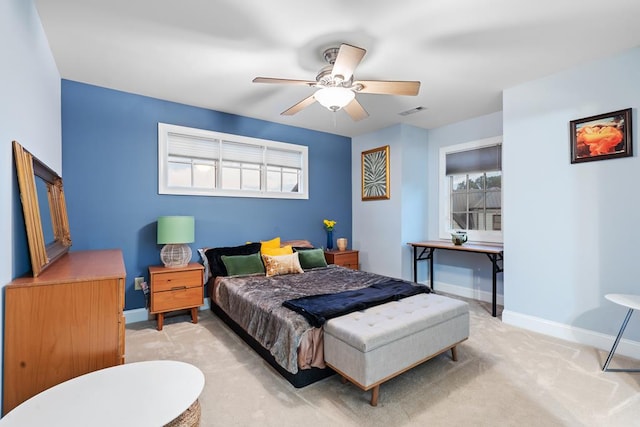 carpeted bedroom with ceiling fan