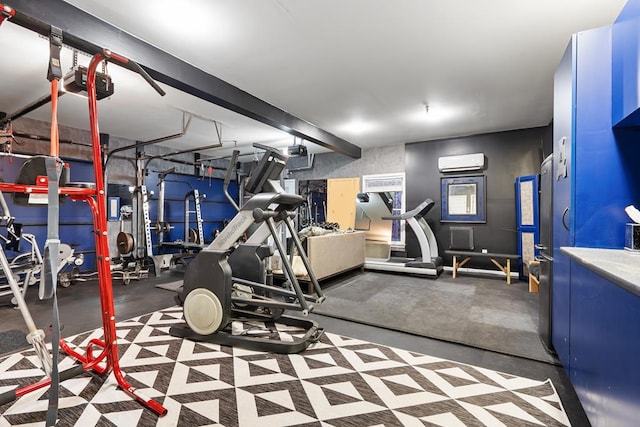 exercise room featuring a wall mounted AC