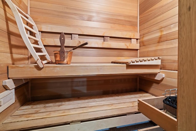 view of sauna with wood walls