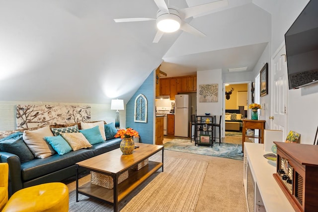 living room with vaulted ceiling, light carpet, and ceiling fan