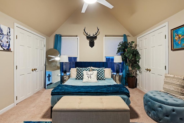 carpeted bedroom featuring ceiling fan and vaulted ceiling