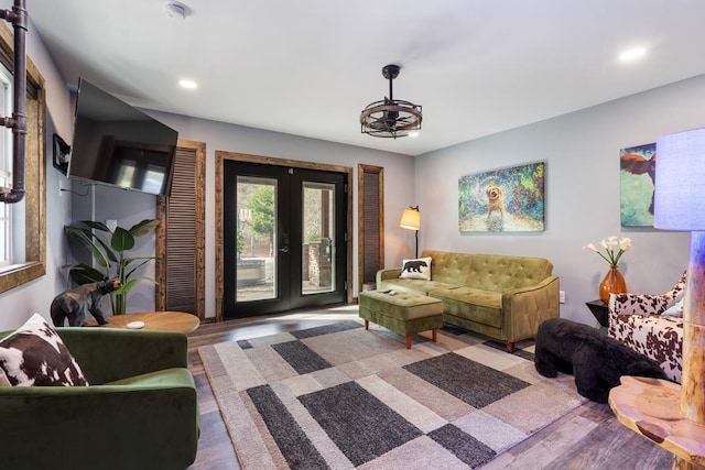 living room with french doors and hardwood / wood-style flooring