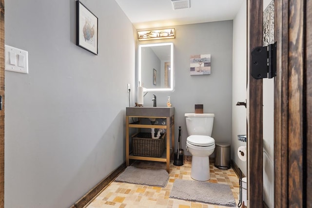 bathroom with sink and toilet