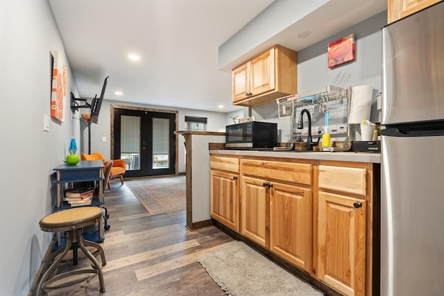 kitchen featuring french doors, appliances with stainless steel finishes, and dark hardwood / wood-style floors