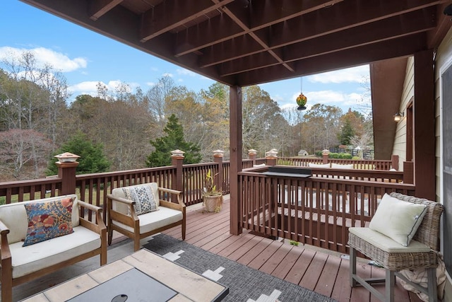 wooden deck featuring outdoor lounge area