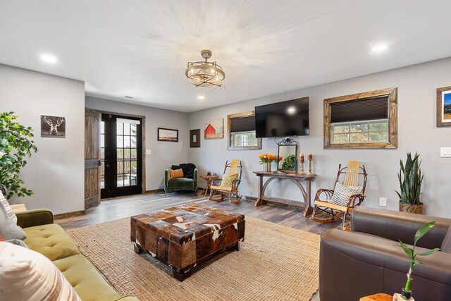 living room featuring light hardwood / wood-style flooring and french doors