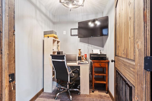 home office with dark hardwood / wood-style floors