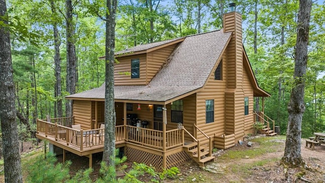 exterior space featuring a wooden deck