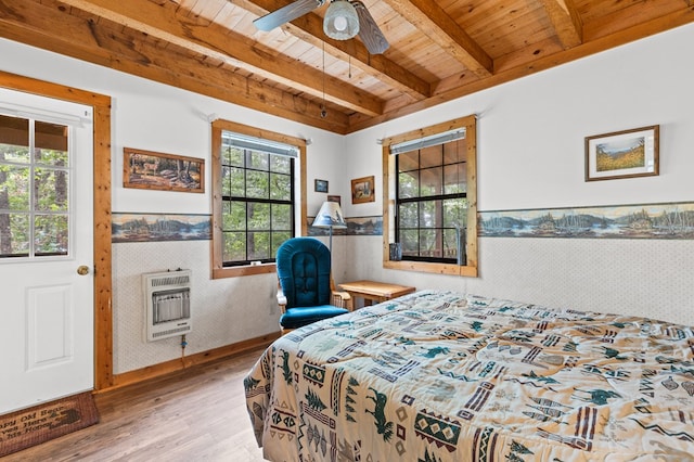 bedroom featuring a wood stove, wood ceiling, ceiling fan, beamed ceiling, and wood-type flooring