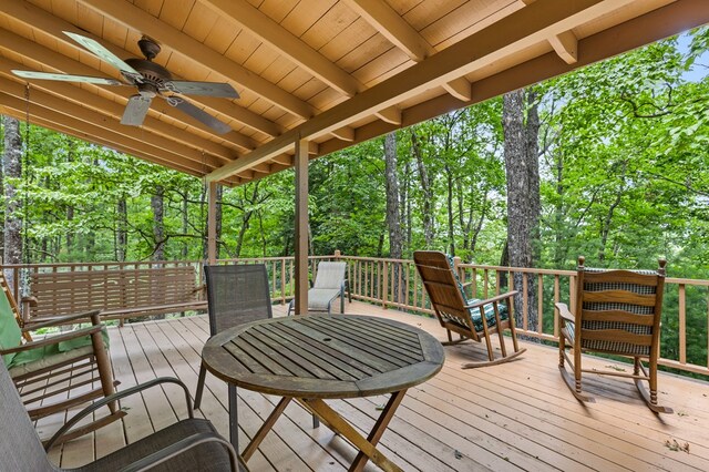 wooden deck featuring ceiling fan