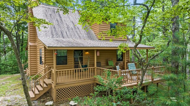 rear view of property with a deck