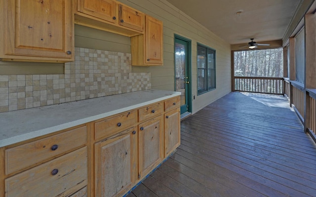 kitchen with light brown cabinetry, backsplash, dark wood-type flooring, and ceiling fan