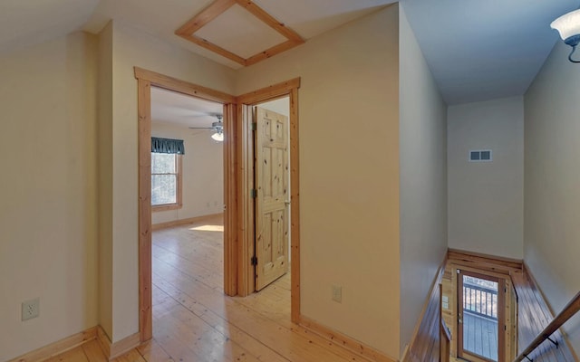 corridor with light wood-type flooring