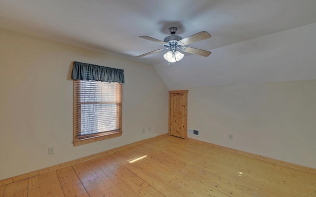 bonus room with ceiling fan, vaulted ceiling, and light wood-type flooring