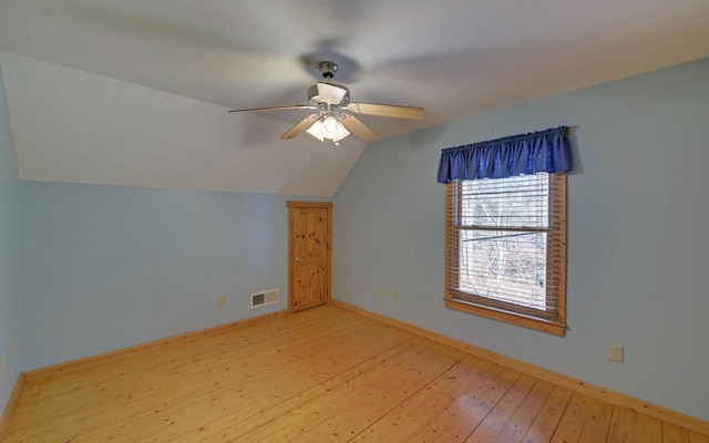 bonus room with vaulted ceiling, light hardwood / wood-style floors, and ceiling fan