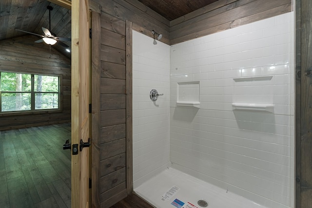 bathroom featuring wooden ceiling, hardwood / wood-style flooring, ceiling fan, lofted ceiling, and wooden walls