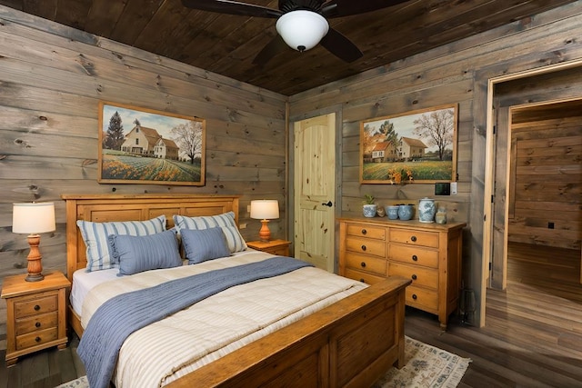 bedroom with wooden ceiling, ceiling fan, wooden walls, and dark hardwood / wood-style flooring