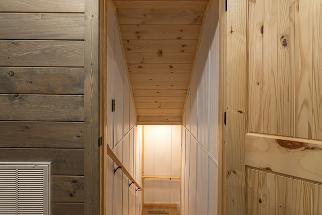 interior details featuring wood walls and wood ceiling