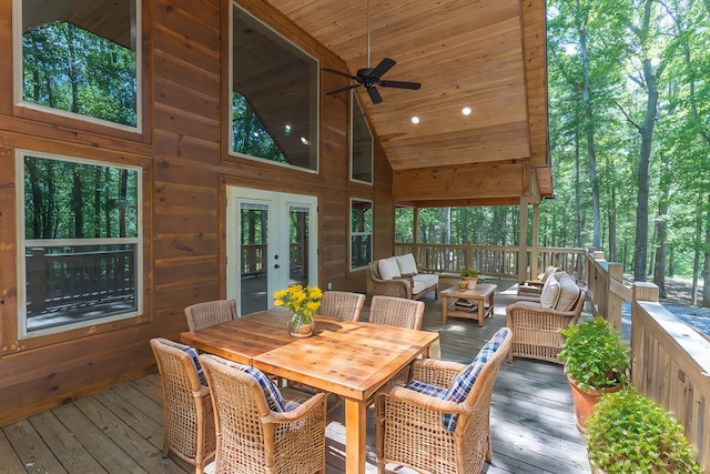 wooden terrace featuring outdoor lounge area and ceiling fan